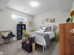 Neutral wall color, wall-to-wall carpeting, and a window with blinds - 