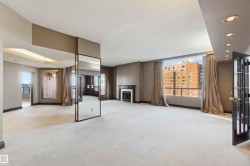 Expansive living area with large windows, a built-in fireplace, recessed lighting, and a full-length mirror partition - 