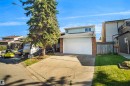 Two-story residence featuring light blue siding and brick accents - 12311 25 Avenue Nw, Edmonton, AB 