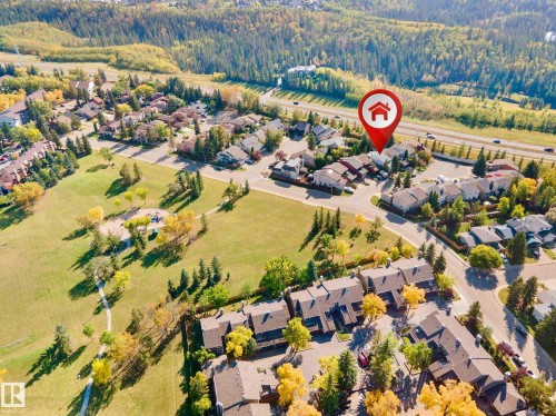 Expansive green spaces, mature tree coverage, residential area, paved roadways, and a multi-lane highway - 12311 25 Avenue Nw, Edmonton, AB 