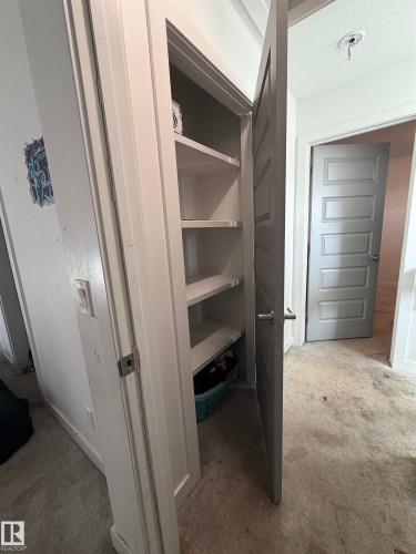 Built-in shelving for organized storage - 11442 82 Street Nw, Edmonton, AB 