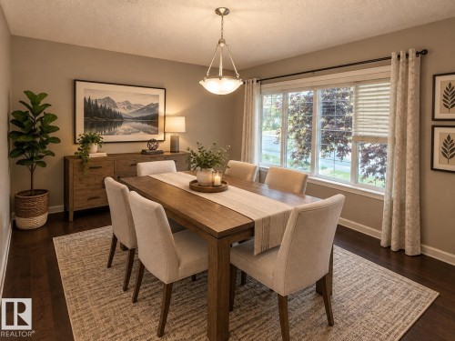 Recessed lighting illuminates wood-finish flooring - 7065 Cardinal Way Sw, Edmonton, AB 