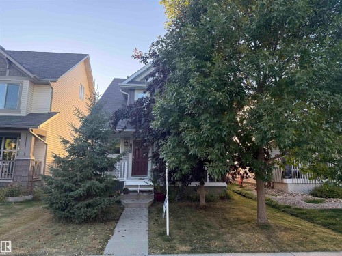 Gabled roofline with dark shingles - 7065 Cardinal Way Sw, Edmonton, AB 