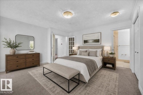 Plush carpet flooring, neutral wall tones, double French doors, recessed ceiling lighting, and an attached three-quarter bathroom with a walk-in shower - 8 Wahstao Crescent Nw, Edmonton, AB 