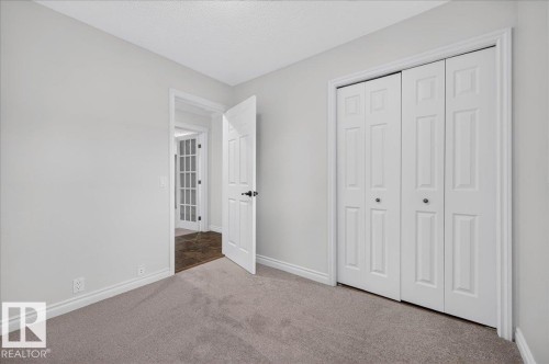 Neutral wall paint with carpeted flooring - 8 Wahstao Crescent Nw, Edmonton, AB 