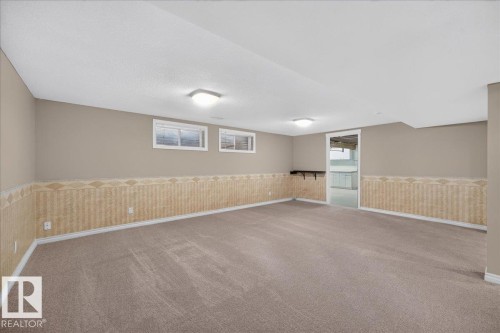Recessed windows, wall-mounted shelving, overhead lighting, and wall-to-wall carpeting - 8 Wahstao Crescent Nw, Edmonton, AB 