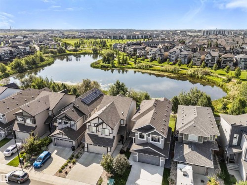 Residential architecture with multiple gabled roofs, paved driveways, and attached garages - 3334 Parker Loop Sw, Edmonton, AB 