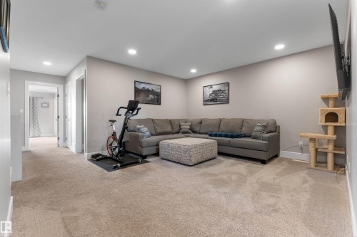 Carpeted flooring, recessed lighting, neutral wall paint, and white trim - 3334 Parker Loop Sw, Edmonton, AB 