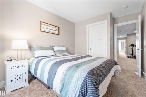 Neutral wall color, carpeted flooring, white interior doors, and recessed ceiling lighting - 3334 Parker Loop Sw, Edmonton, AB 
