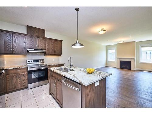 115 Borden Trail, Welland, ON - Indoor Photo Showing Kitchen With Fireplace With Double Sink