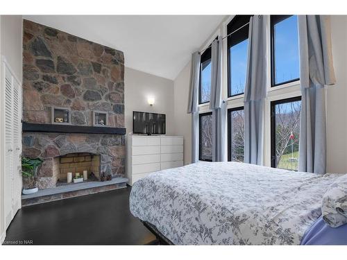 1782 York Road, Niagara-On-The-Lake, ON - Indoor Photo Showing Bedroom With Fireplace