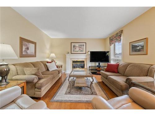 24 Farris Avenue, St. Catharines, ON - Indoor Photo Showing Living Room With Fireplace