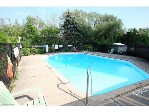 704-215 Glenridge Avenue, St. Catharines, ON - Outdoor With In Ground Pool With Backyard