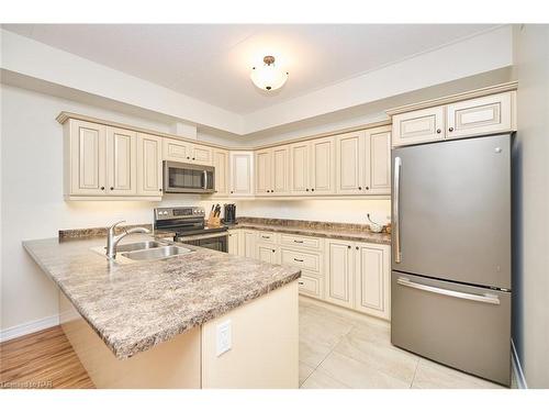 113-4644 Pettit Avenue, Niagara Falls, ON - Indoor Photo Showing Kitchen With Double Sink