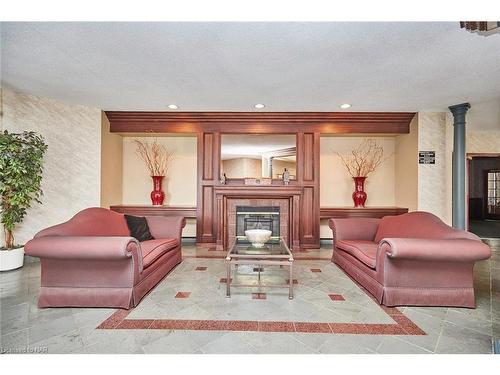 226-8111 Forest Glen Drive, Niagara Falls, ON - Indoor Photo Showing Living Room With Fireplace