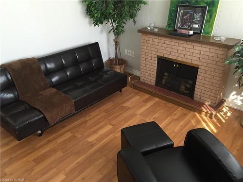 5597 Dorchester Road, Niagara Falls, ON - Indoor Photo Showing Living Room With Fireplace
