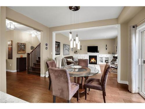 4512 Cinnamon Grove, Niagara Falls, ON - Indoor Photo Showing Dining Room With Fireplace