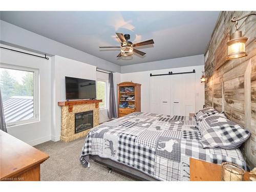 9695 Grassy Brook Road, Niagara Falls, ON - Indoor Photo Showing Bedroom With Fireplace