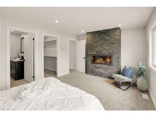 24 Ridge Road S, Ridgeway, ON - Indoor Photo Showing Bedroom With Fireplace
