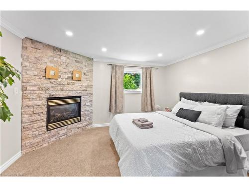 4145 Rebstock Road, Crystal Beach, ON - Indoor Photo Showing Bedroom With Fireplace