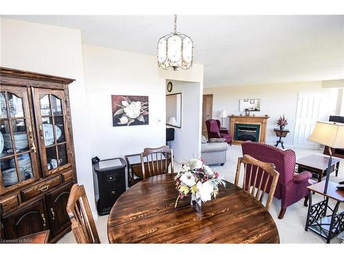 1001-7 Gale Crescent, St. Catharines, ON - Indoor Photo Showing Dining Room With Fireplace