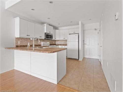 207-6928 Ailanthus Avenue, Niagara Falls, ON - Indoor Photo Showing Kitchen With Double Sink