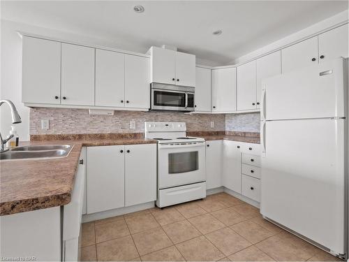 207-6928 Ailanthus Avenue, Niagara Falls, ON - Indoor Photo Showing Kitchen With Double Sink