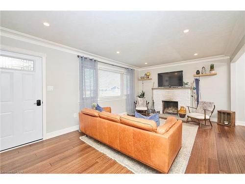 12 Corbett Avenue, St. Catharines, ON - Indoor Photo Showing Living Room With Fireplace