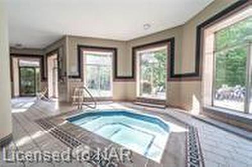 306-8111 Forest Glen Drive, Niagara Falls, ON - Indoor Photo Showing Other Room With In Ground Pool