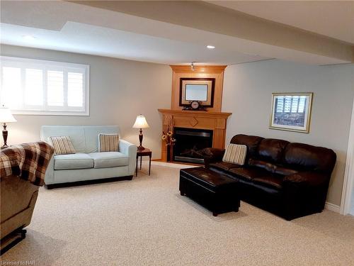 7721 Bishop Avenue, Niagara Falls, ON - Indoor Photo Showing Living Room With Fireplace