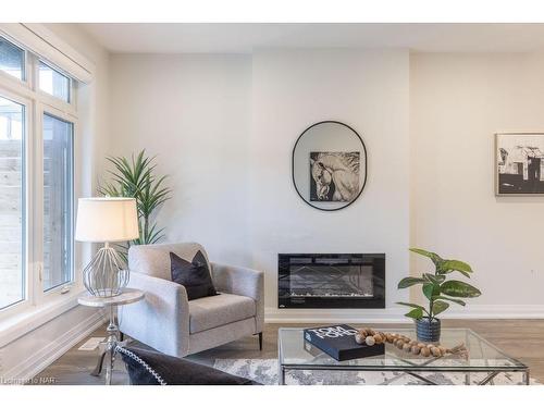 16-8974 Willoughby Drive, Niagara Falls, ON - Indoor Photo Showing Living Room With Fireplace