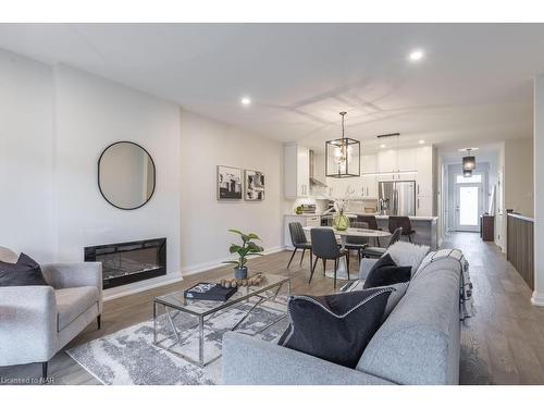 16-8974 Willoughby Drive, Niagara Falls, ON - Indoor Photo Showing Living Room With Fireplace