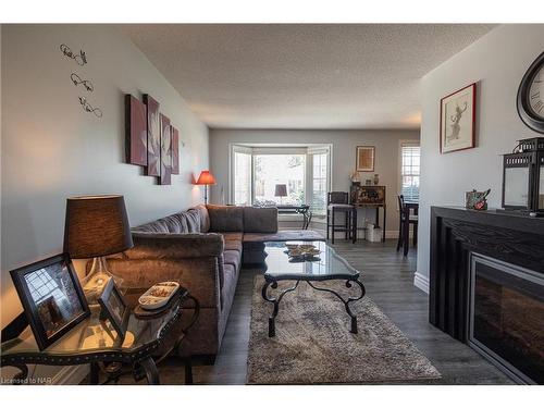 7992 Post Road, Niagara Falls, ON - Indoor Photo Showing Living Room With Fireplace