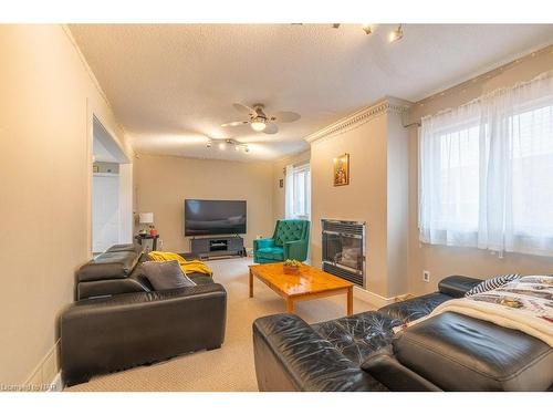 26 Remigio Court, Thorold, ON - Indoor Photo Showing Living Room With Fireplace