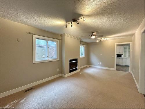 26 Remigio Court, Thorold, ON - Indoor Photo Showing Living Room With Fireplace