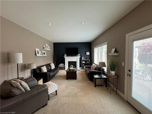 8 Moes Crescent, St. Catharines, ON - Indoor Photo Showing Living Room With Fireplace