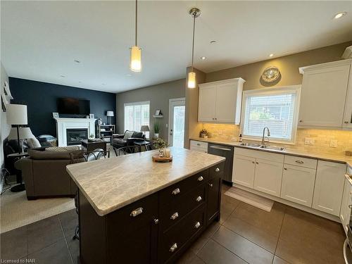 8 Moes Crescent, St. Catharines, ON - Indoor Photo Showing Kitchen With Fireplace With Double Sink