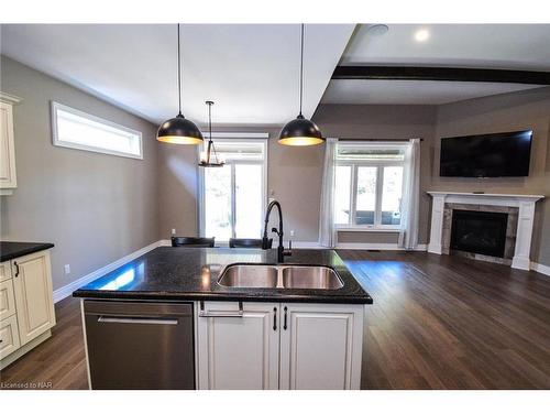 3990 Village Creek Drive, Stevensville, ON - Indoor Photo Showing Kitchen With Fireplace With Double Sink