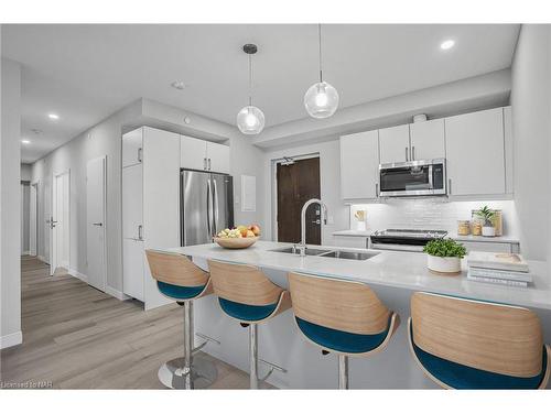 707-118 West Street, Port Colborne, ON - Indoor Photo Showing Kitchen With Stainless Steel Kitchen With Double Sink With Upgraded Kitchen