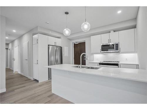 707-118 West Street, Port Colborne, ON - Indoor Photo Showing Kitchen With Stainless Steel Kitchen With Double Sink With Upgraded Kitchen