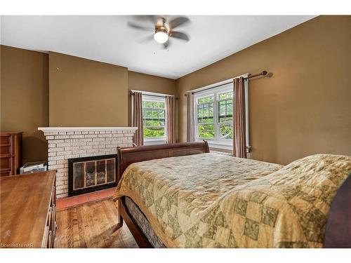 88 Pine Street N, Thorold, ON - Indoor Photo Showing Bedroom With Fireplace