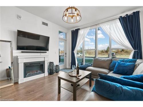 117-16 Concord Place, Grimsby, ON - Indoor Photo Showing Living Room With Fireplace