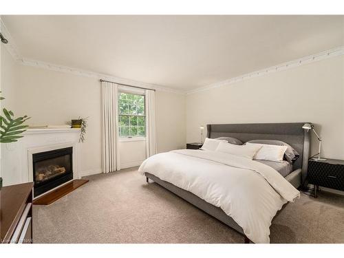 1170 Centre Street, Fenwick, ON - Indoor Photo Showing Bedroom With Fireplace