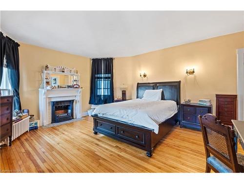 14 Catharine Street, Port Colborne, ON - Indoor Photo Showing Bedroom With Fireplace