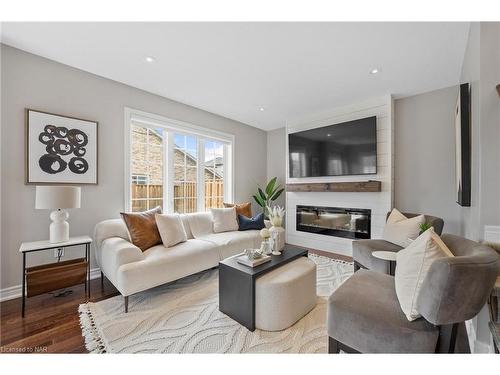 1-77 Avery Crescent, St. Catharines, ON - Indoor Photo Showing Living Room With Fireplace