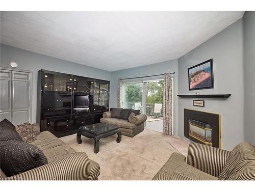 84 Merritt Street, St. Catharines, ON - Indoor Photo Showing Living Room With Fireplace