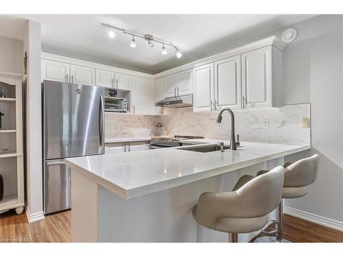 211-2010 Cleaver Avenue, Burlington, ON - Indoor Photo Showing Kitchen With Stainless Steel Kitchen With Double Sink With Upgraded Kitchen