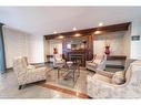 209-8111 Forest Glen Drive, Niagara Falls, ON  - Indoor Photo Showing Living Room With Fireplace 