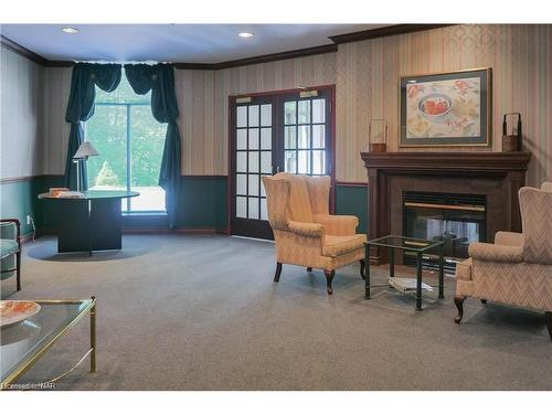 209-8111 Forest Glen Drive, Niagara Falls, ON - Indoor Photo Showing Living Room With Fireplace