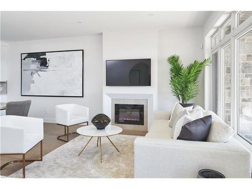 70C-586 Seneca Drive, Fort Erie, ON - Indoor Photo Showing Living Room With Fireplace